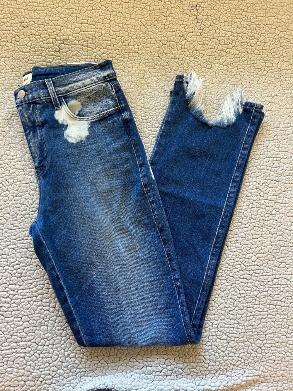 L'Agence -- high rise dark blue slim straight jeans, acid wash details